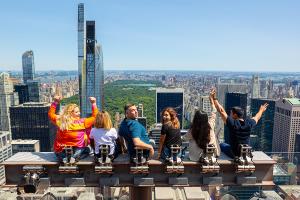 students on top of building